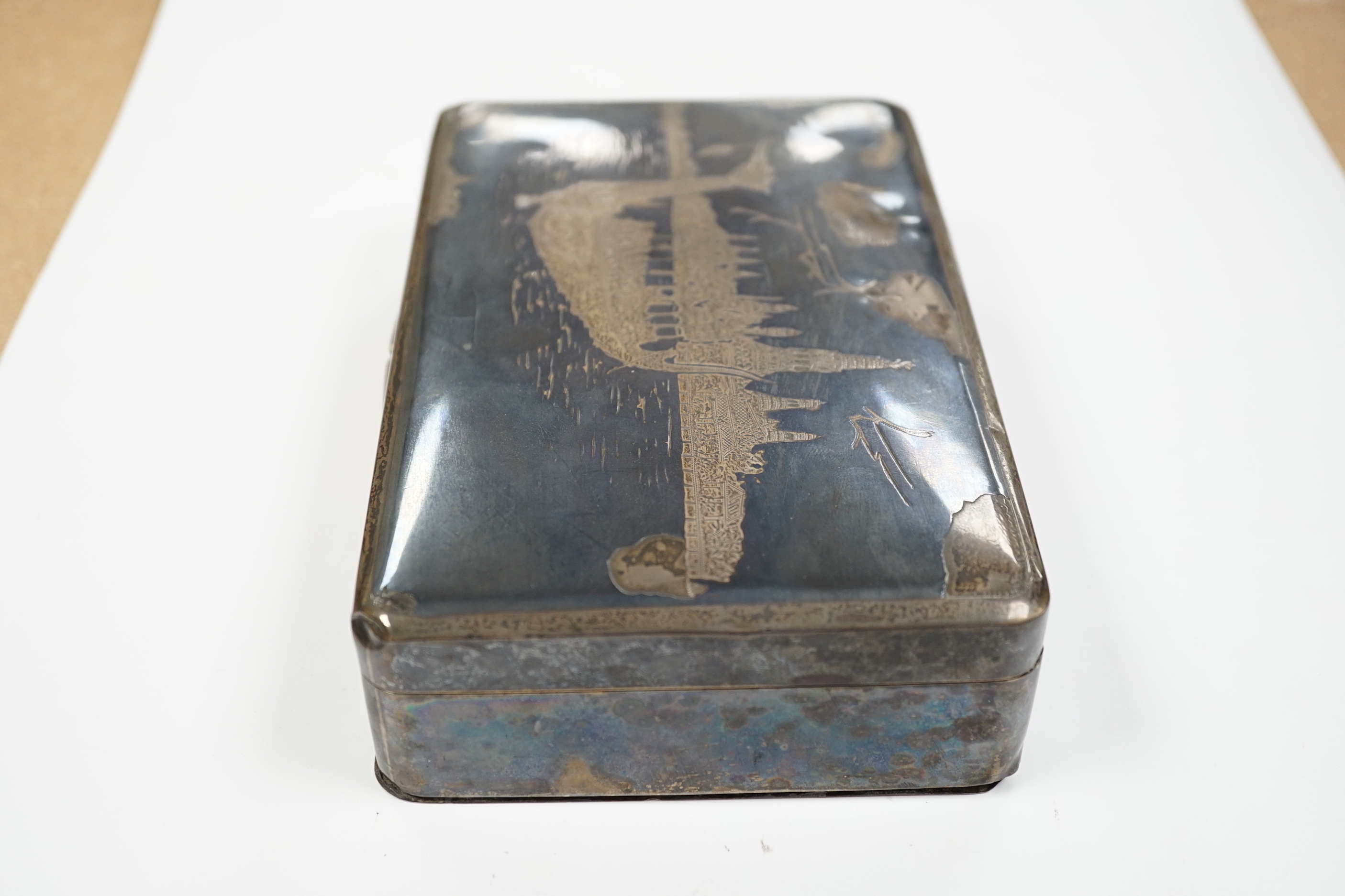 A Thai white metal and niello cigarette box, 18cm.